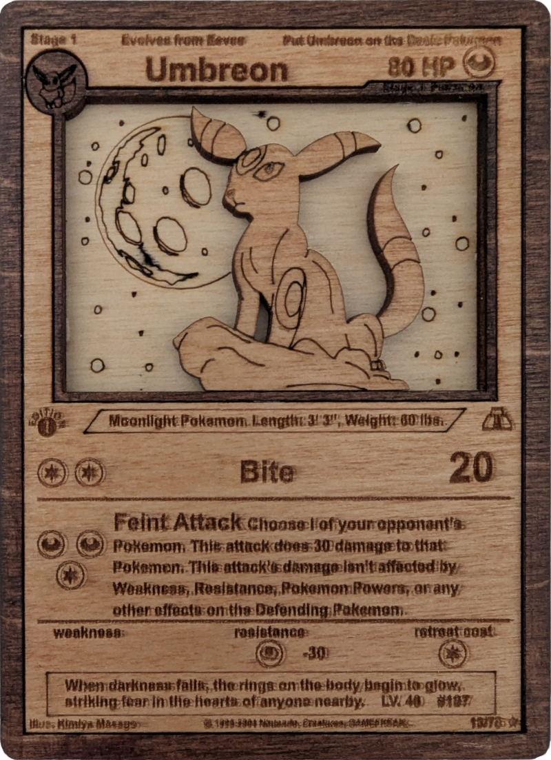 A wooden Umbreon pokemon card