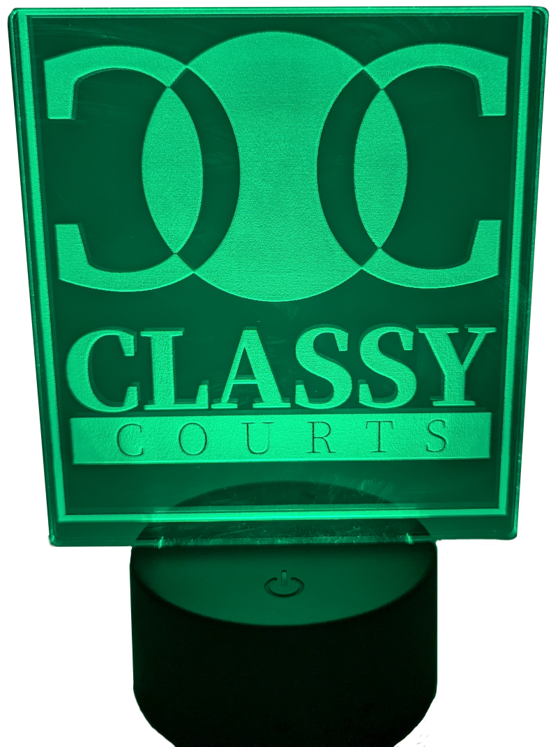 A lighted sign showing Classy Courts