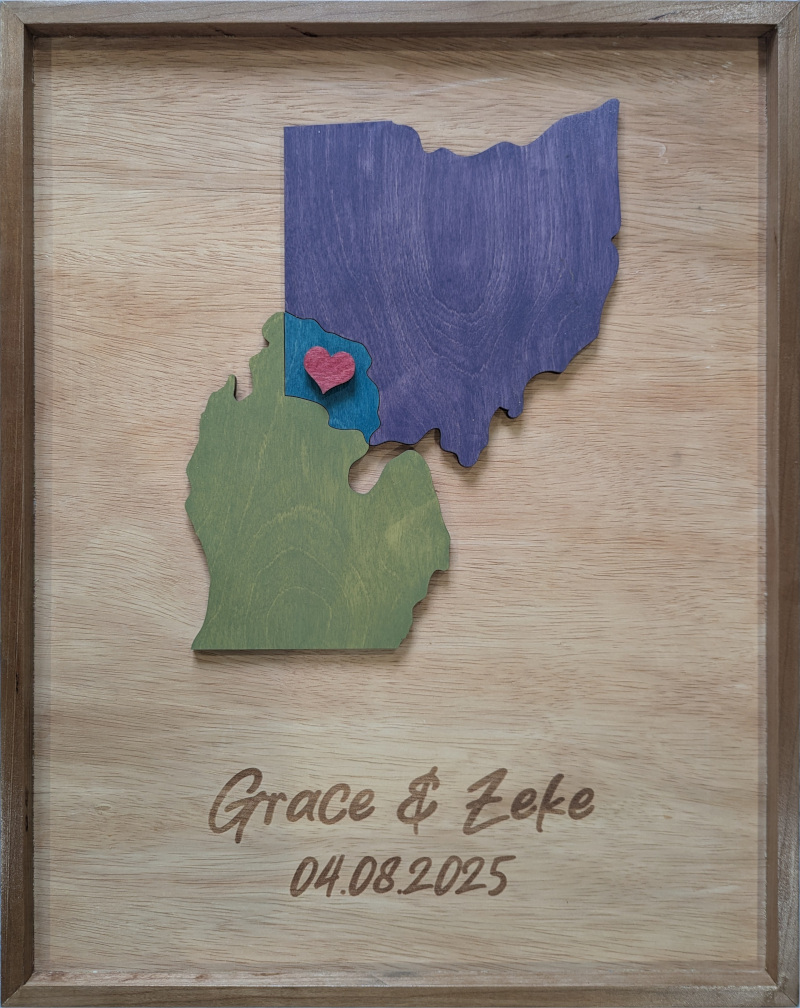 A wedding sign showing Michigan and Ohio joined with a heart